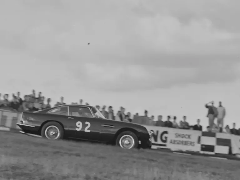  Chassis number DB4GT/0124/R as seen at Brands Hatch driven by Jack Sears in 1960.