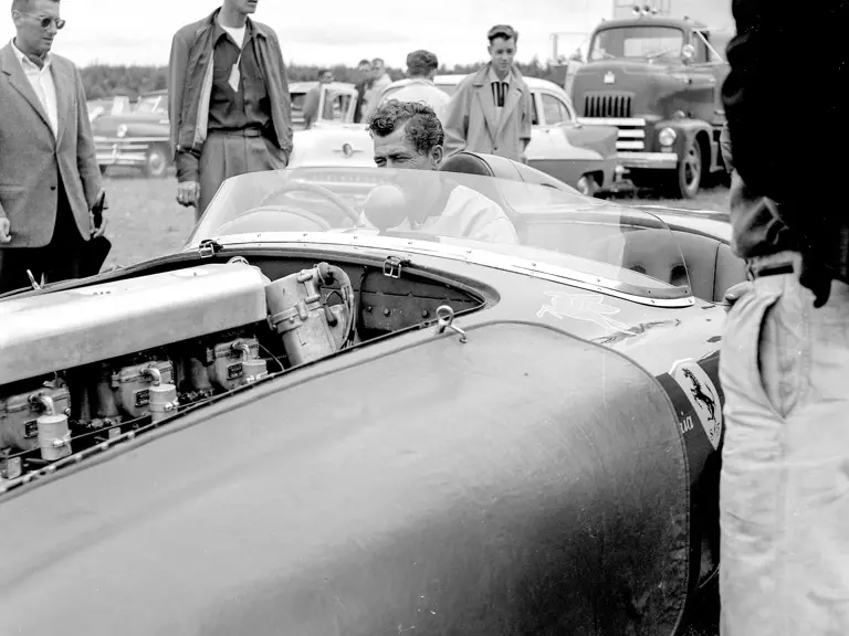 Carroll Shelby grins at the sweet sounds being made by his Ferrari, chassis no. 0478 AM (#103), in the paddock before the start of the feature race at the 31 July 1955 SCCA Nationals held at Bremerton, Washington.