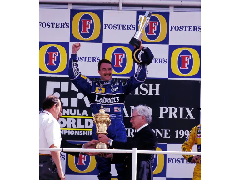 Race winner Nigel Mansell (GBR) Williams celebrates on the podium.
Formula One World Championship, Rd9, British Grand Prix, Silverstone, 12 July 1992.