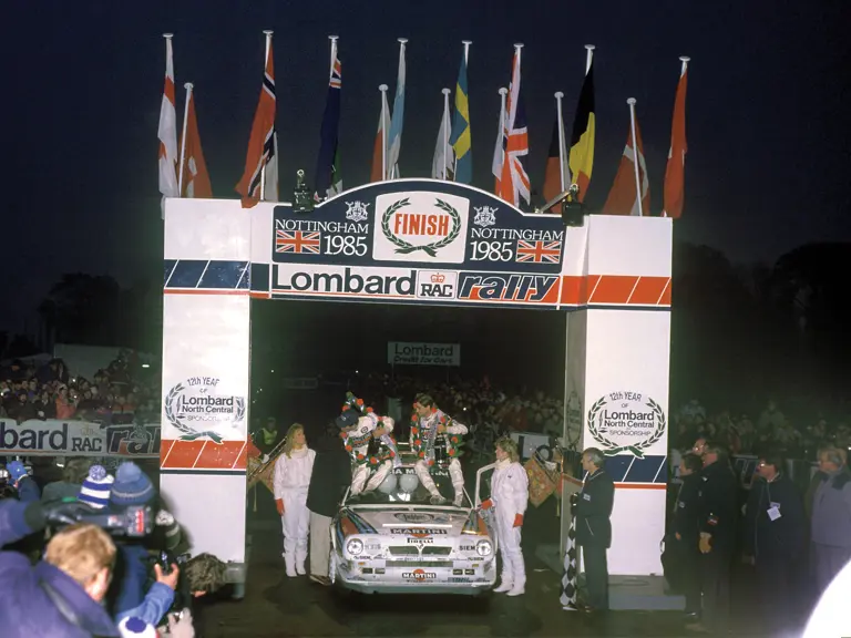 Henri Toivonen and Neil Wilson celebrate their victory after the 1985 Lombard RAC Rally.