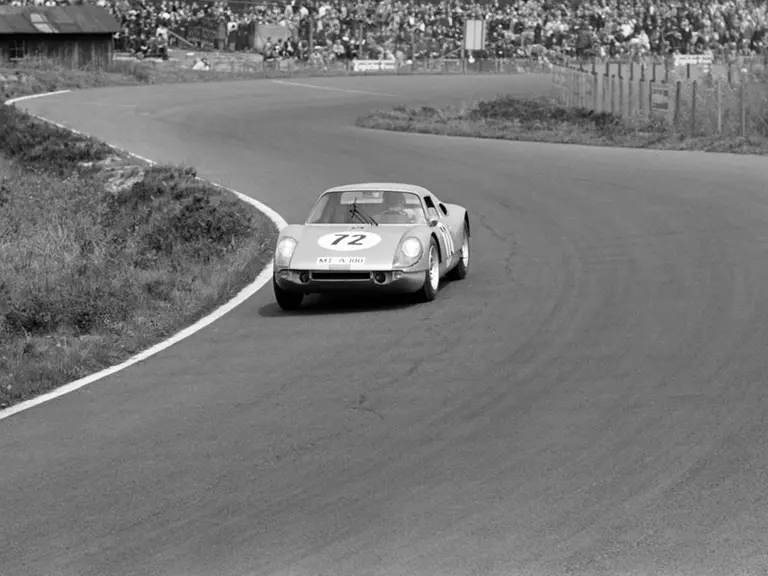 Seen here manoeuvring through the twists and turns of the Nürburgring, Udo Schütz and Anton Fischhaber drove chassis 036 to finish 11th overall and 1st in the GT class at the Nürburgring 1000 Kilometres on 23 May 1965.