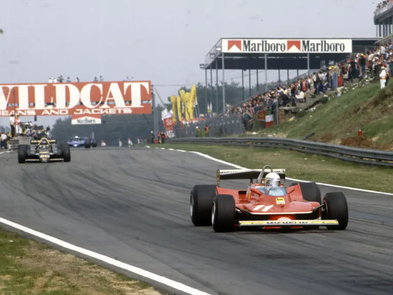 Scheckter leads British racing legend James Hunt at the 1979 Belgian Grand Prix, where the Ferrari driver claimed outright victory.