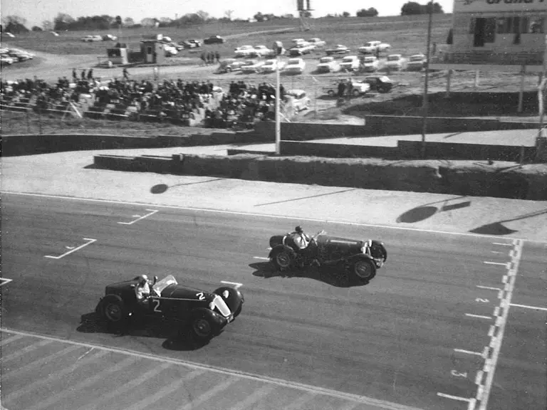 0312901, #2, races to the finish line against SF28 at Kyalami, ca. 1960s.