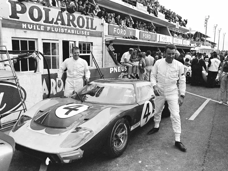 Holman-Moody’s #4 Ford GT40 Mk II (P/1032) and drivers Mark Donohue (left) and Paul Hawkins (right) at the 1966 24 Hours of Le Mans.