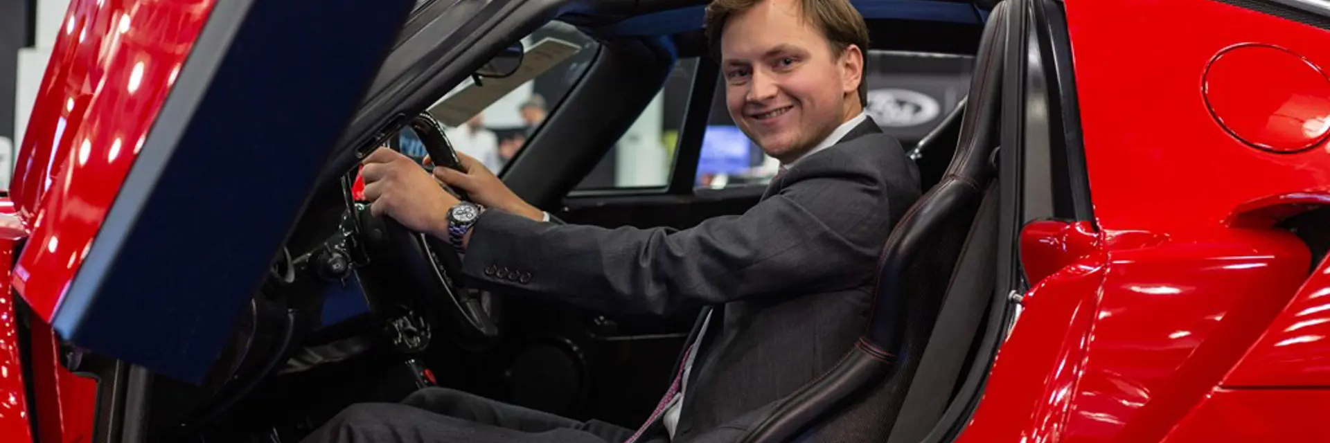 RM Sothebys Car Specialist Stephan Knobloch sitting in a 2003 Ferrari Enzo at London Fall 2019 