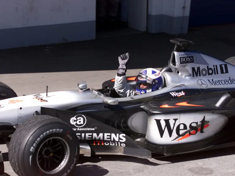 David Coulthard celebrates winning the 2001 Austrian Grand Prix.