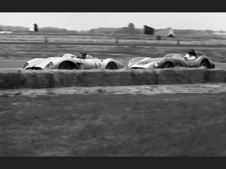 Richie Ginther behind the wheel of chassis no. 0680 MDTR (race #11) leads a Scarab (race #16) piloted by Lance Reventlow at the Santa Barbara Road Races, 1958.