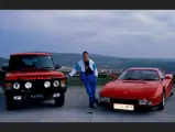 Nigel Mansell is pictured with his Ferrari Testarossa, presented to the driver while racing for Scuderia Ferrari.