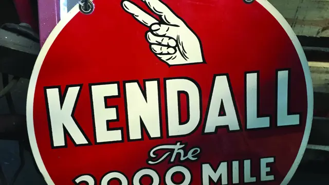 A rare, double-sided, tin painted, Kendall The 2000 Mile Oil sign