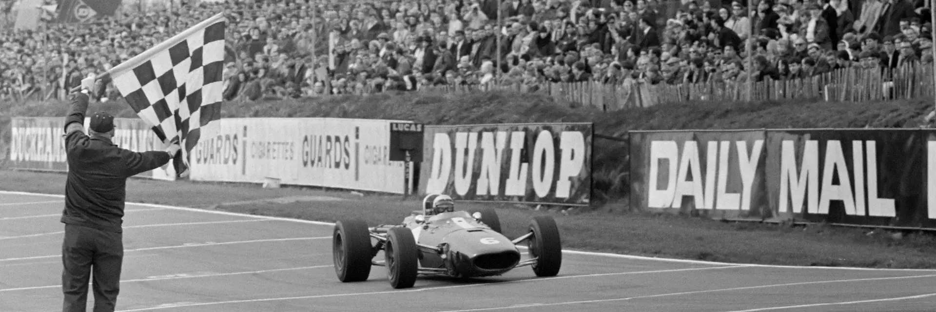 Rich Ginther crosses the line at the 1967 Race of Champions at Brands Hatch.