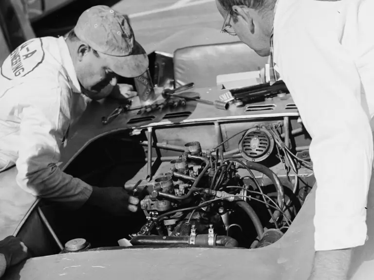 Two race mechanics carry out pre-race checks on chassis 5042 before the start of the 1953 SCCA National March.