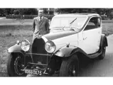 Former owner Philippe Vernholes stands with the Bugatti.