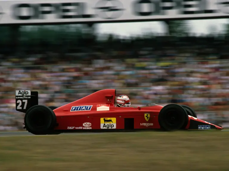 Nigel Mansell drives past the Hockenheim stands in the Ferrari 640, “chassis 109”, on 30 July 1989.