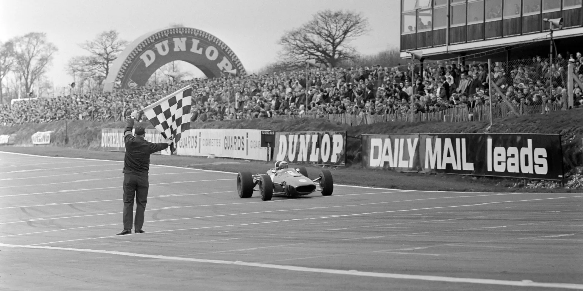 Rich Ginther crosses the line at the 1967 Race of Champions at Brands Hatch.