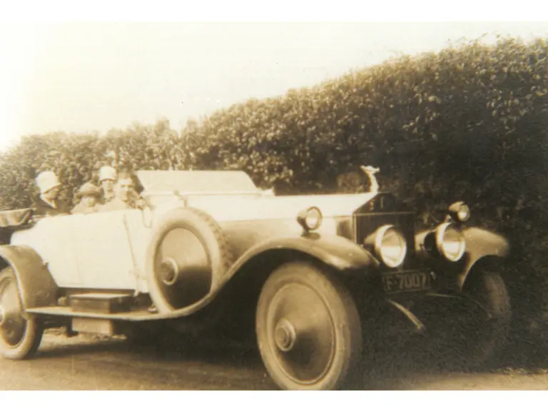 The Rolls-Royce is driven by the original owner and their family during the 1920s.