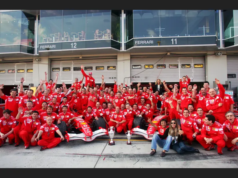 Scuderia Ferrari celebrates Michael Schumacher and Felipe Massa finishing first and third at the 2006 European Grand Prix.