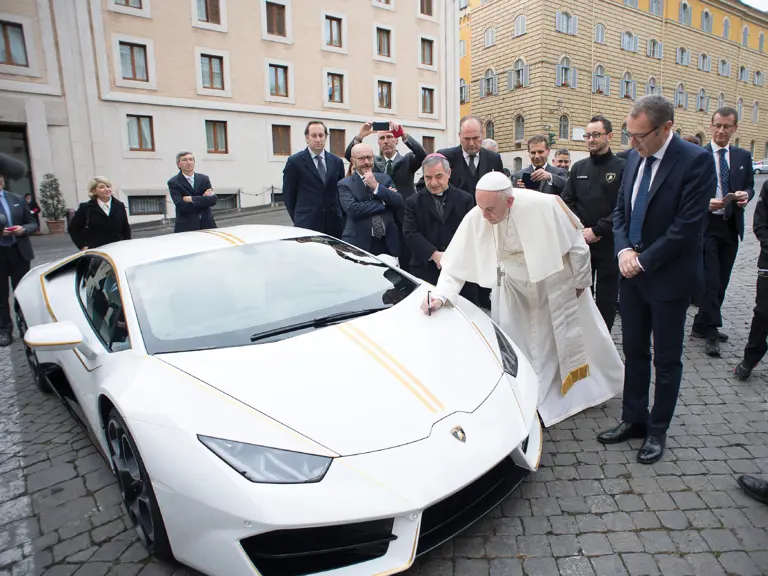 His Holiness Pope Francis signs the Lamborghini Huracán at a ceremony in Vatican City in November of 2017.
