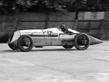 The Leyland-Thomas Special flies down Brooklands Circuit during an event in 1924.