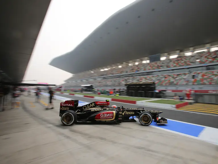 Romain Grosjean leaves the pit lane at the 2013 Indian Grand Prix.