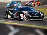 The Iron Lynx Ferrari 488 GTE Evo leads two Porsche 991 RSRs at the 2021 24 Hours of Le Mans.