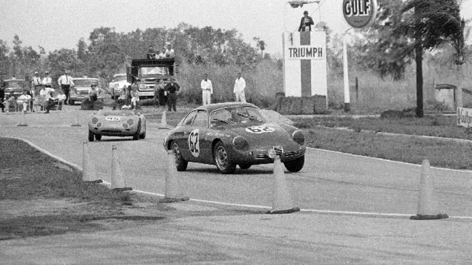 Chassis number 0200 (#62) leads a Porsche 718 RSK (#45) through a turn at the 1962 12 Hours of Sebring. Chassis number 0200 (#62) leads a Porsche 718 RSK (#45) through a turn at the 1962 12 Hours of Sebring.