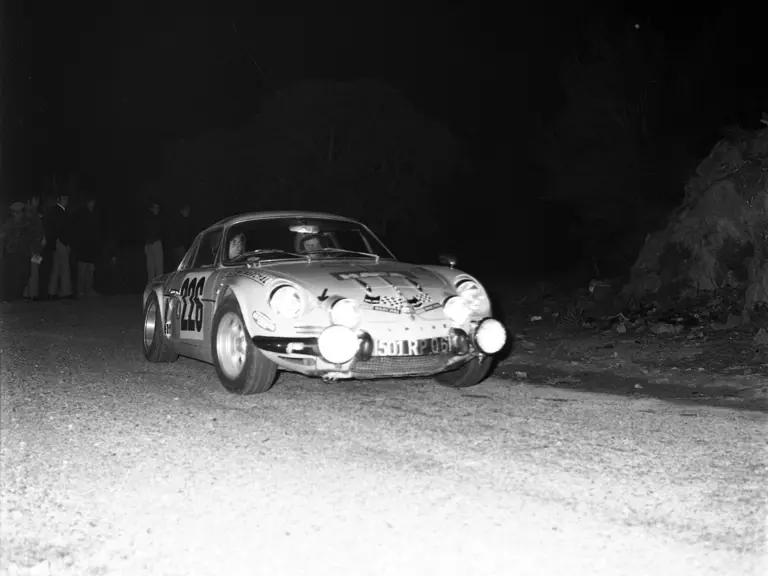 The Jaune Rédélé Alpine A110 rounds a corner during the night stage of the Tour Ile de Beauté.